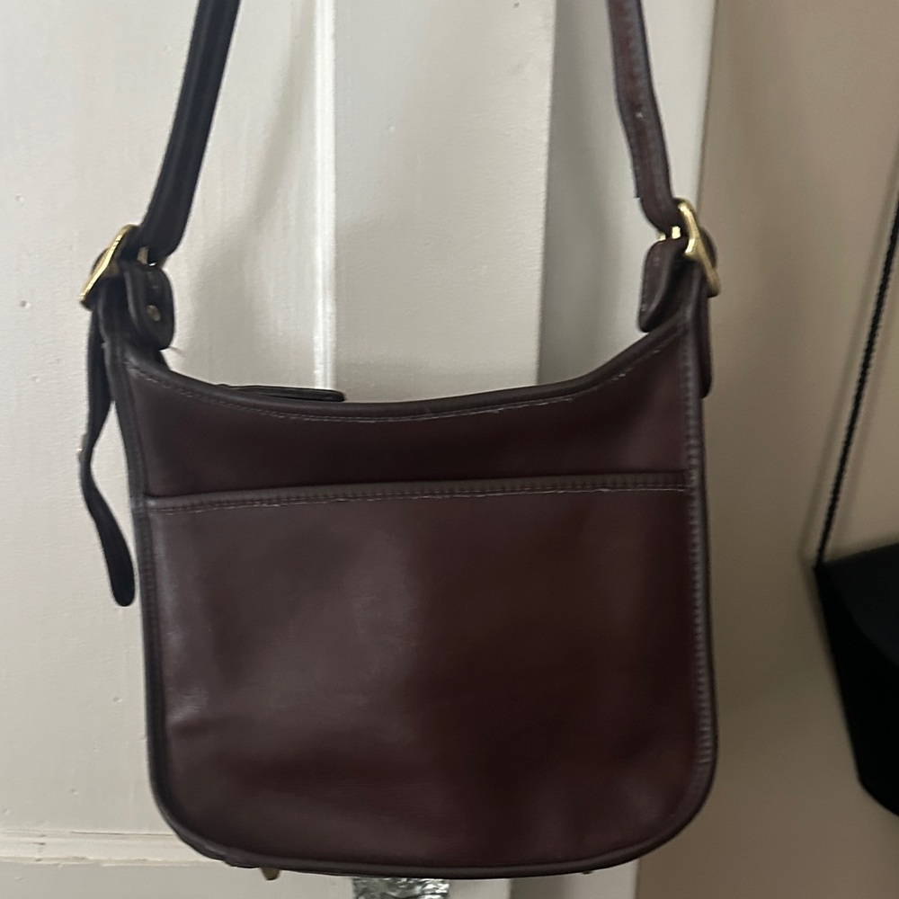 Vintage Coach Legacy Zip Bag in mahogany brown leather.